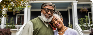 Man and Woman in Front of House